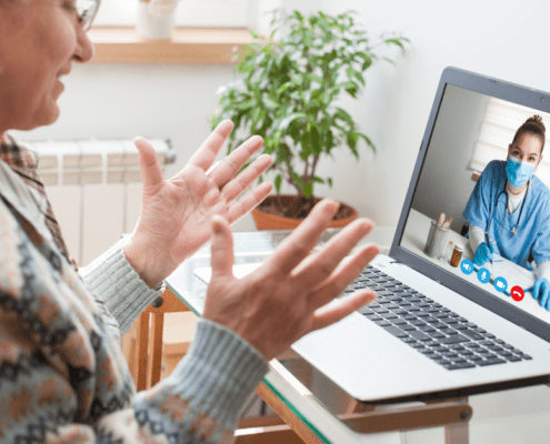 elderly woman on a telemedicine video call with her healthcare provider